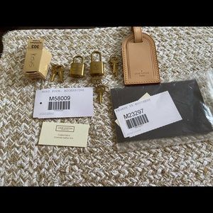 Authentic Louis Vuitton luggage tag locks and keys